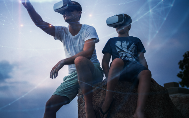 Two boys using VR devices
