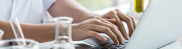 Person-working-on-laptop-at-lab-bench-iStock-1135584308-2-HEADER-2400x1600.jpg