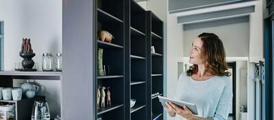 Woman on smart device in smart home