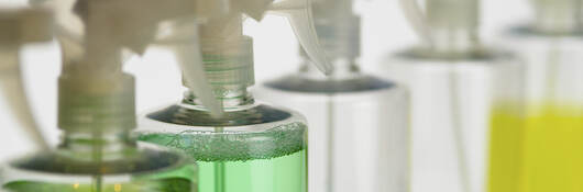 Spray bottles of cleaners and sanitation products