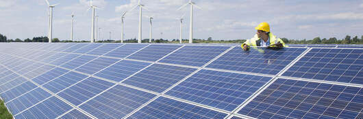 Man checking on solar panels