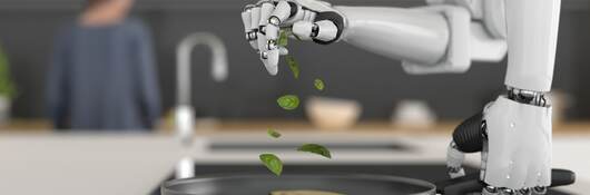 Robotic arms preparing a meal.