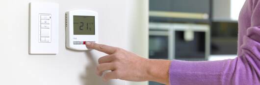 Woman changing heating.