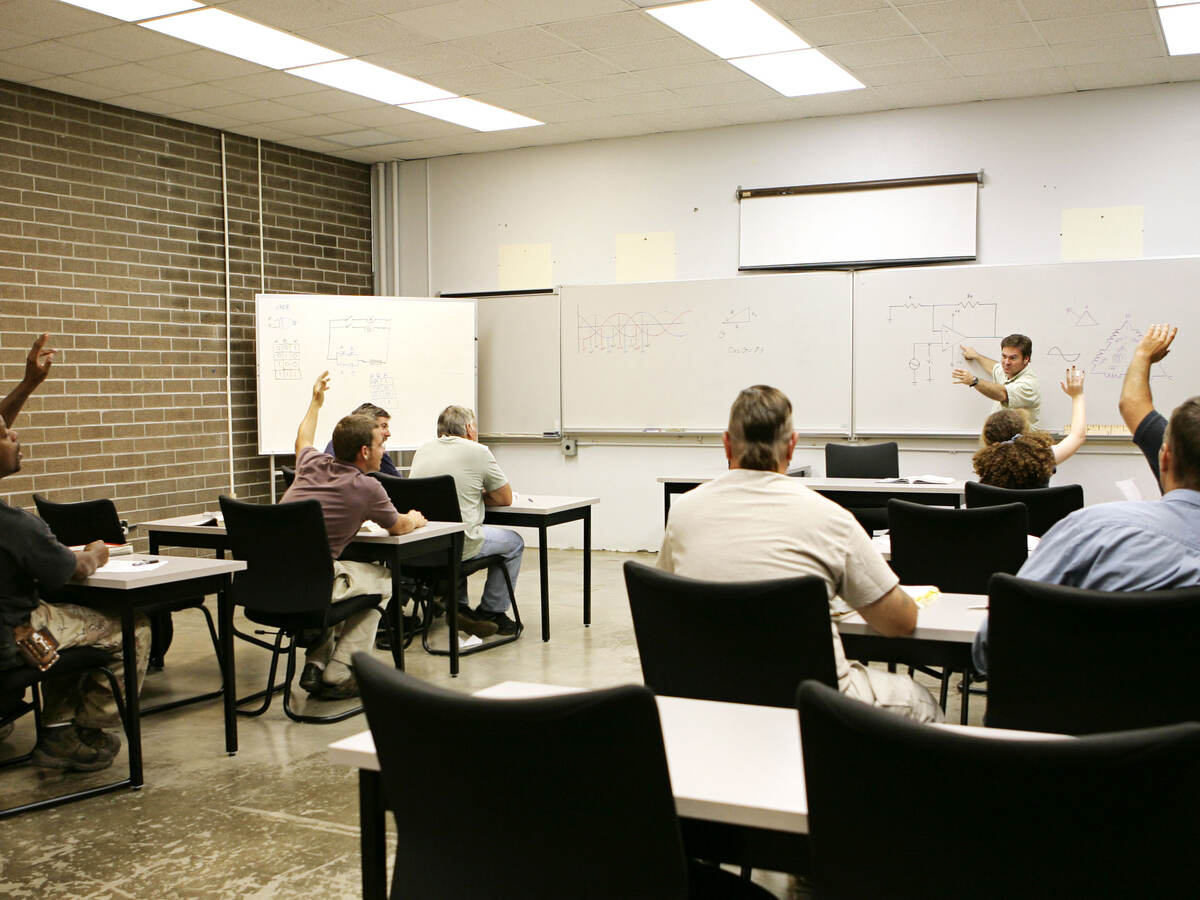 A classroom of individuals learns more about hazardous location training. 