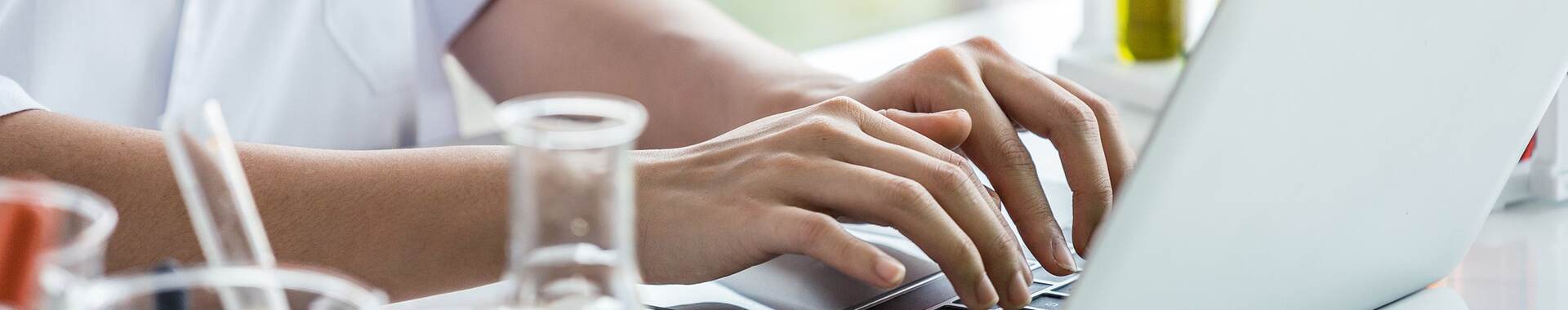 Person-working-on-laptop-at-lab-bench-iStock-1135584308-2-HEADER-2400x1600